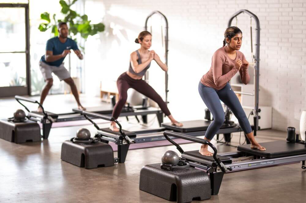 Pilates session using the Allegro Tower of Power equipment.