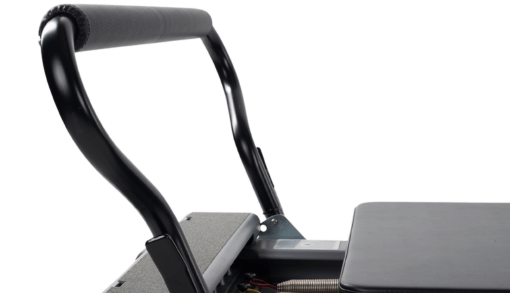 Adjustable Pilates footbar with two-way adjustability and padding.