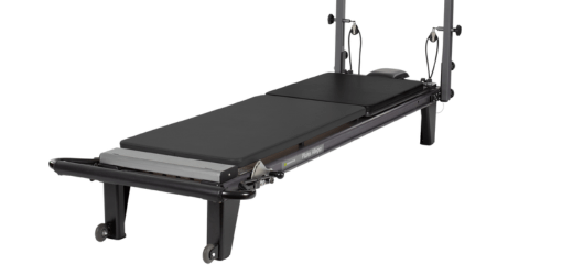 Black reformer mat with heavy-duty vinyl upholstery on frame.