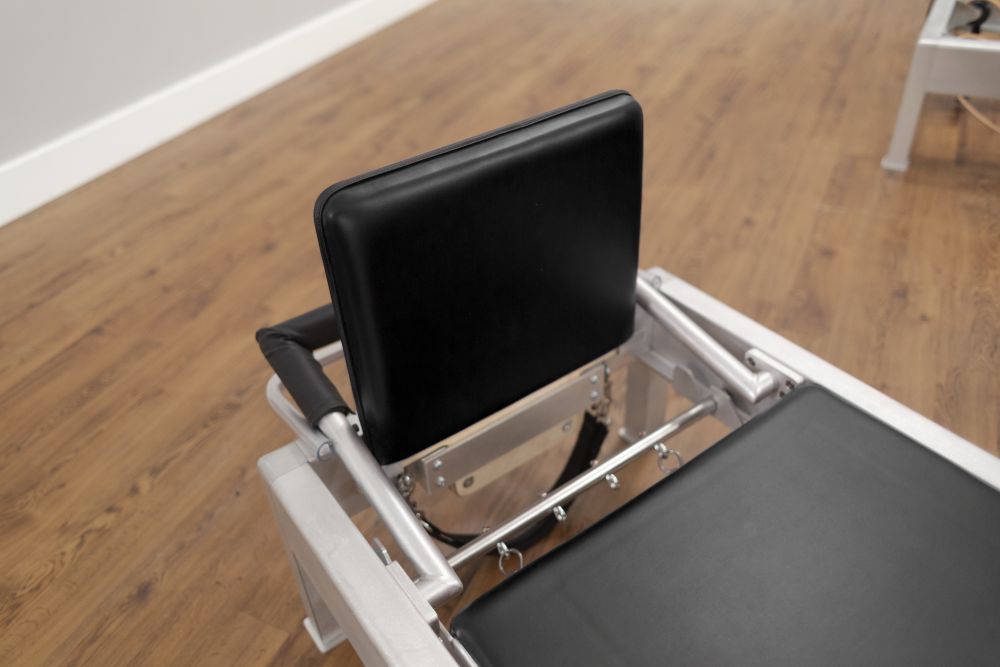Contrology Jumpboard on Reformer for Pilates cardio exercises.