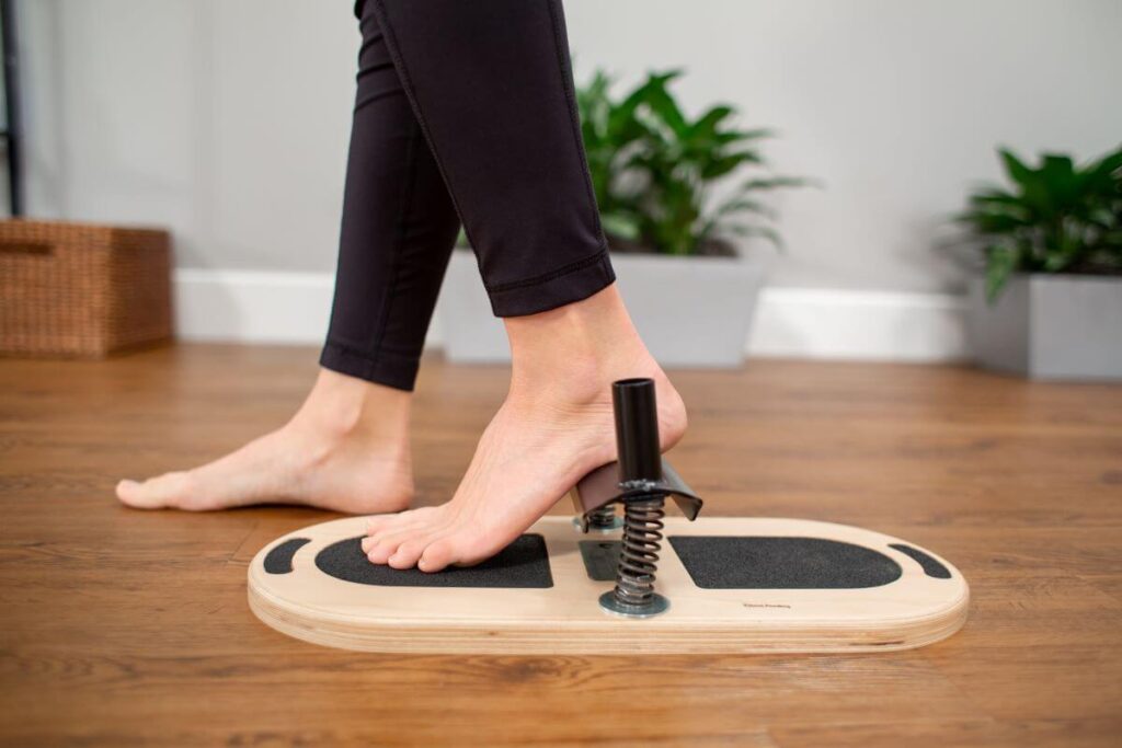 Using the Balanced Body Foot Corrector for foot strength and balance.
