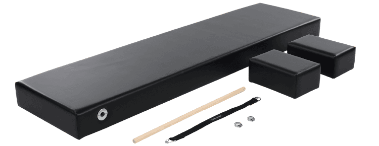 Professional Pilates Mat with Accessories Black upholstered Pilates mat with dowel handles, foot strap, and Moon Boxes.