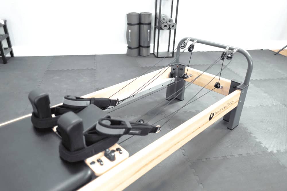 Rialto Reformer Konnector with single-rope system on the floor.