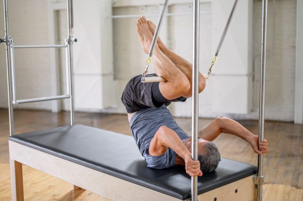 Pilates exercise using Balanced Body Trapeze Signature Springs.
